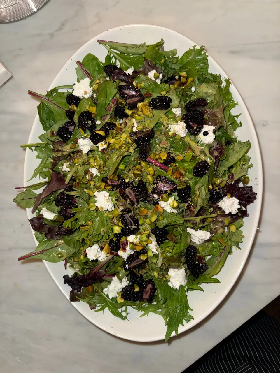 Mixed greens with blackberries, crumbled goat cheese and chopped pistachios